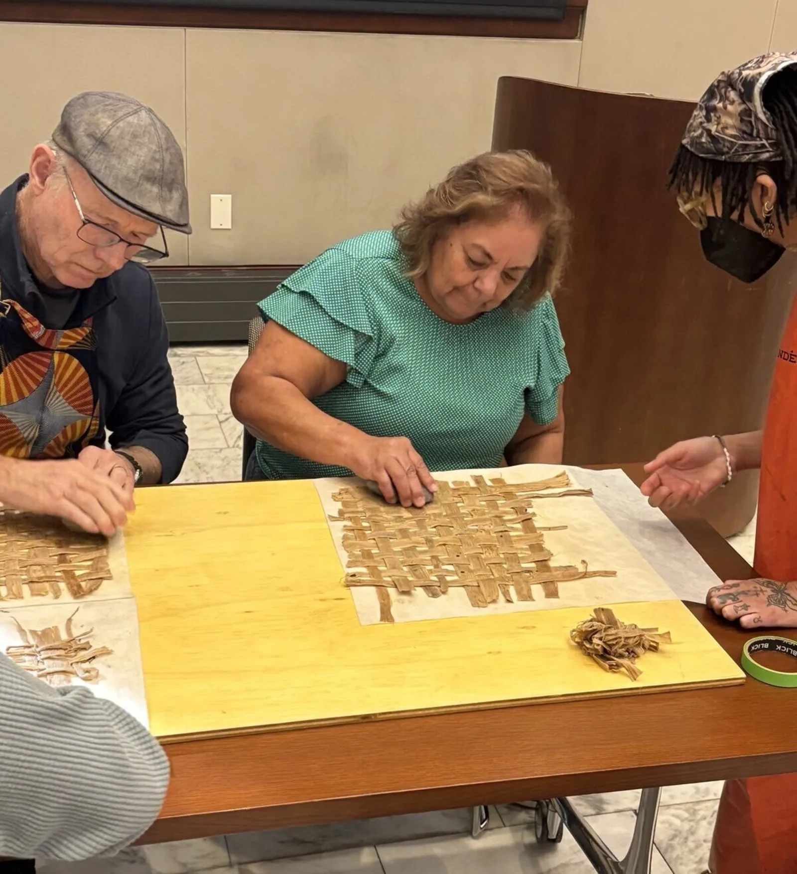 Patron Using Rock to Mash Bark Fibers into Amate Paper